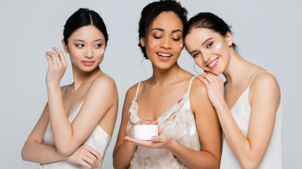 Three_women_holding_skincare_product