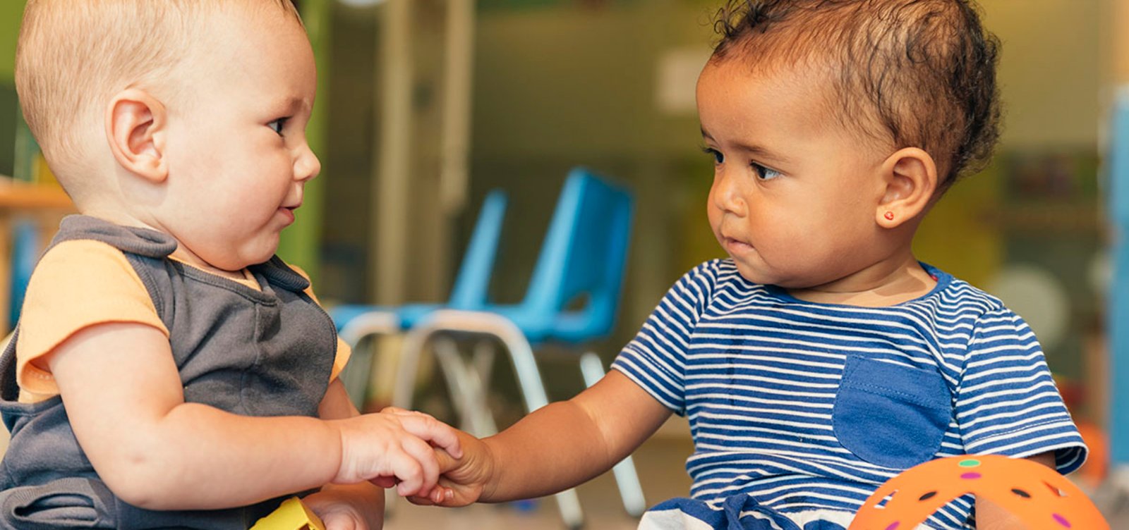 Babys playing together in the kindergarten.