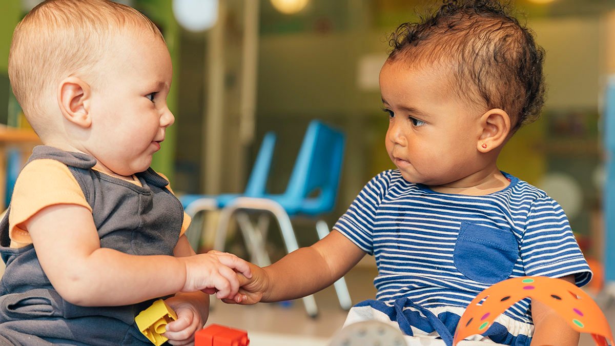 Babys playing together in the kindergarten.